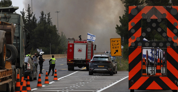 Israel reopens key roads as firefighter’s battle blaze